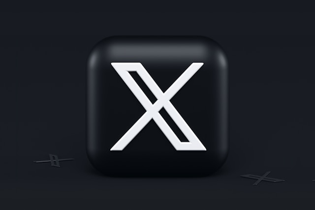 Rendu 3D du logo de X sur un fond noir.