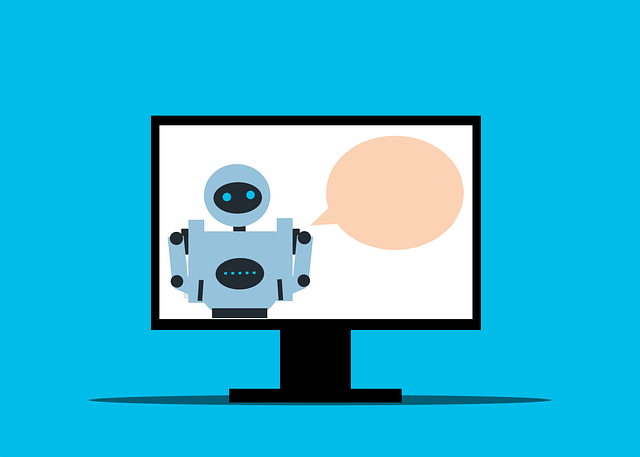 Ilustrasi monitor desktop hitam yang menampilkan robot dengan kotak komentar di sisi kanannya.