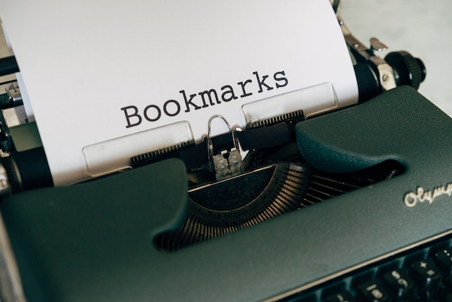 A picture of a typewriter with a paper with the word “Bookmarks.”