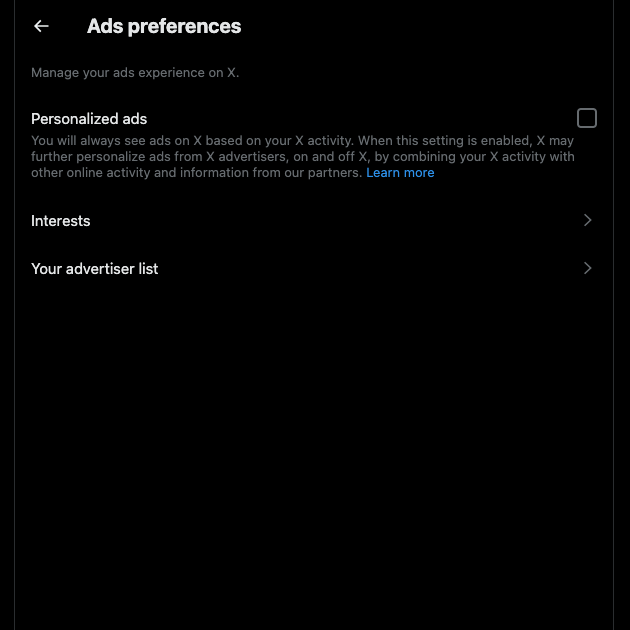A person reduces their digital footprint by turning off personalized ads on Twitter or X.