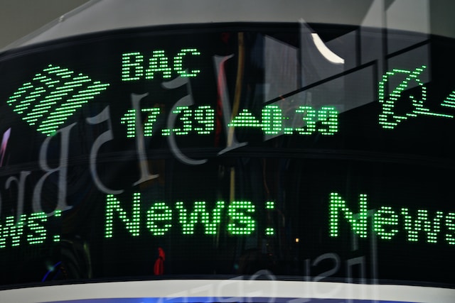 A closeup picker of a stock market ticker board showing a listed stock.