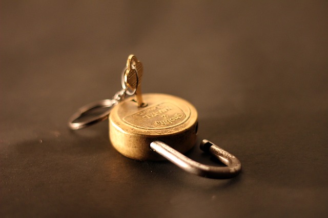 A picture of a padlock and its key attached.