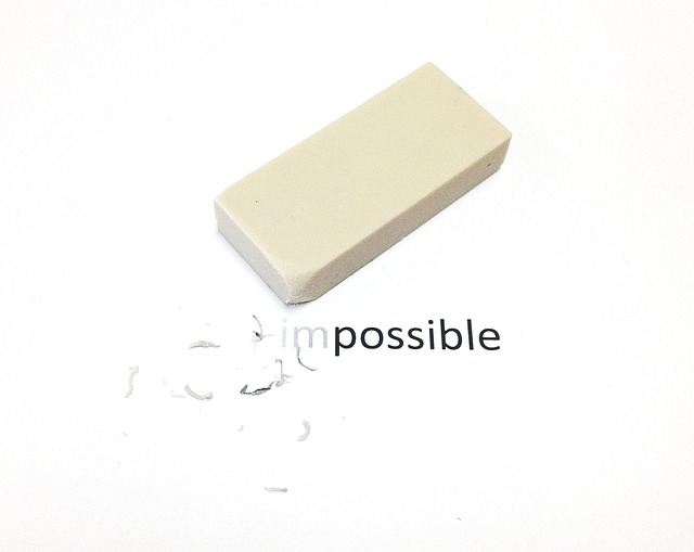 A white eraser on top of the word impossible.
