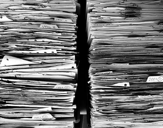 A close-up of two stacks of papers next to each other.