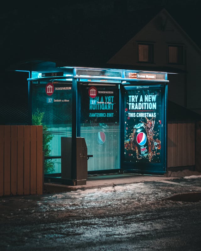 A bus stop with a Pepsi advertisement.