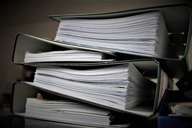 A close-up of several files with multiple documents.